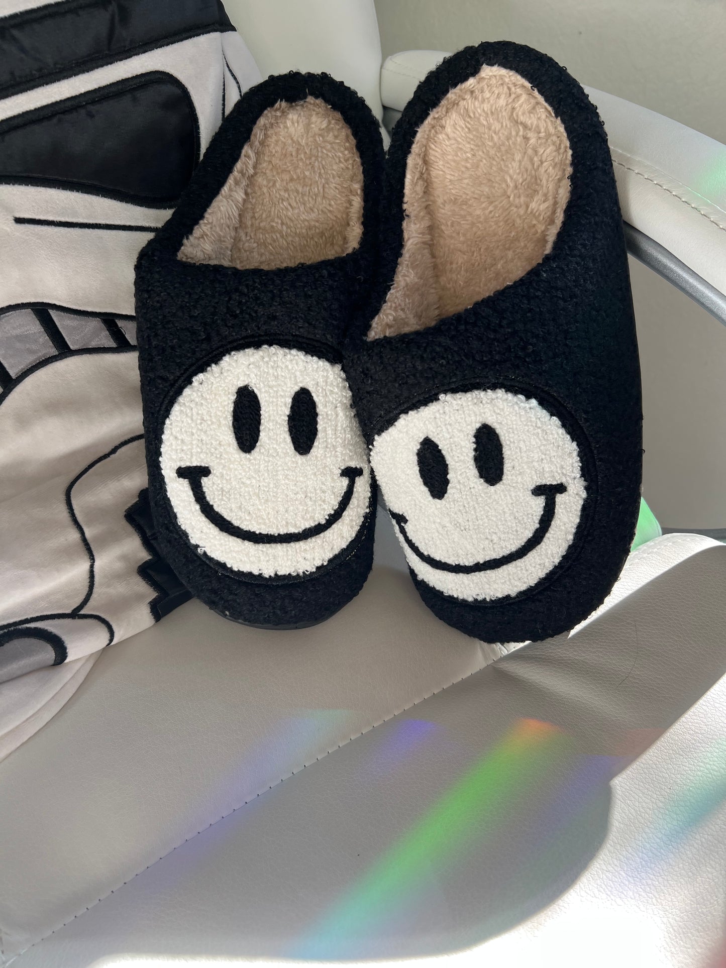 black and white smiley face slippers