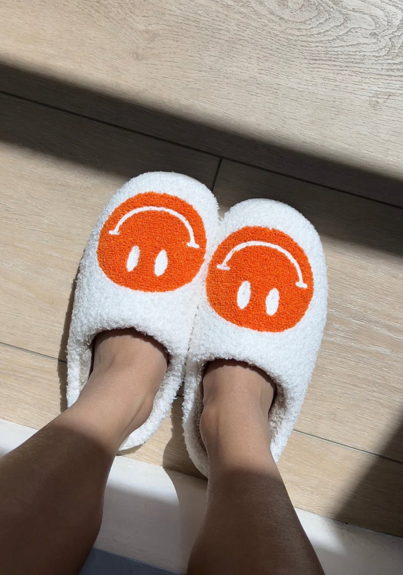 butter yellow smiley face slippers