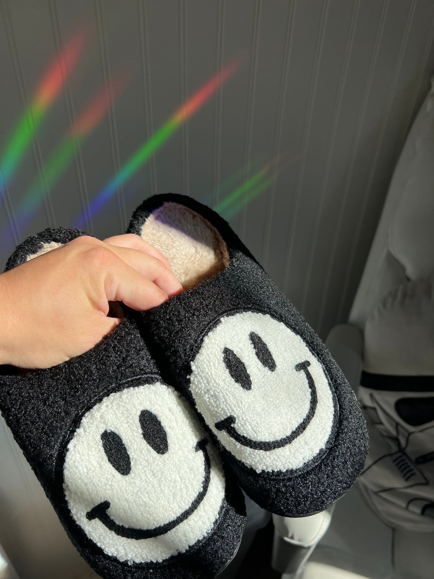 black and white smiley face slippers